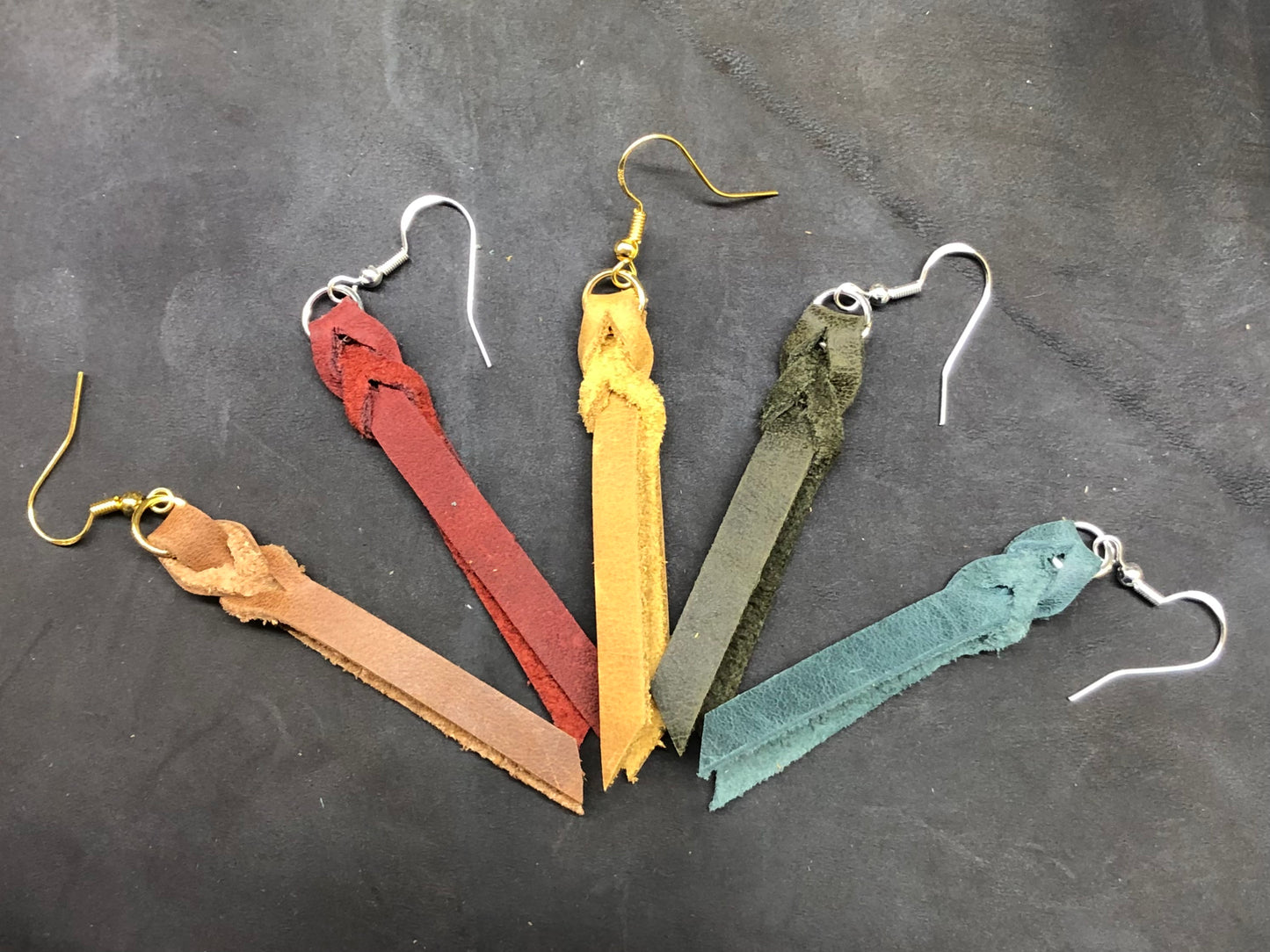 Examples of other leather options. Left to Right: Driftwood, Nautical Red, Sunset Yellow, Seaweed and Carribean Blue